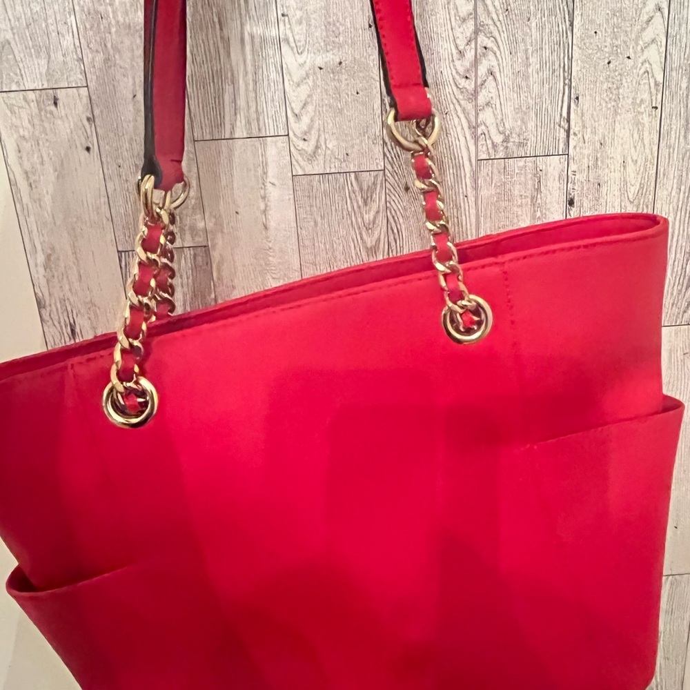 Well made, sturdy-Definitely genuine. Vibrant red CK bag V. Good condition